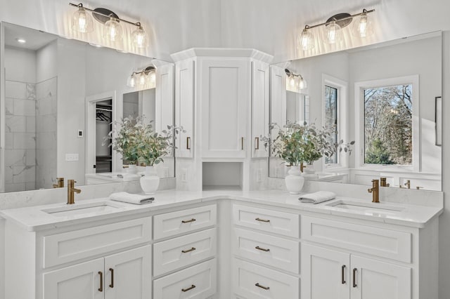 bathroom with a shower and vanity