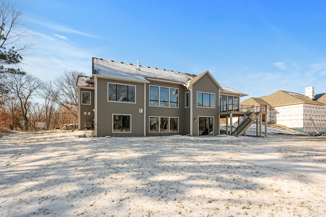 back of property featuring a wooden deck