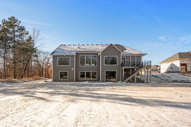 back of property featuring a sunroom