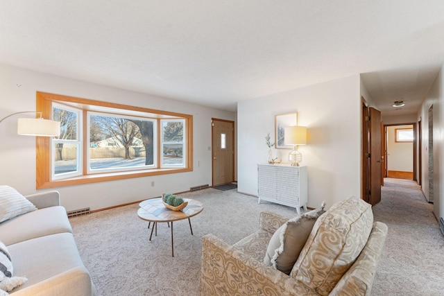 carpeted living room with a healthy amount of sunlight