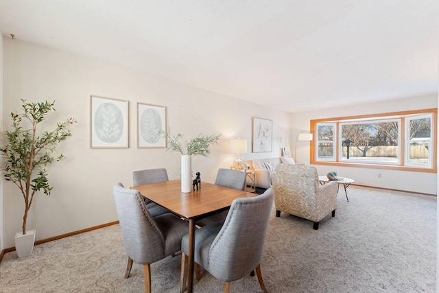 view of carpeted dining space