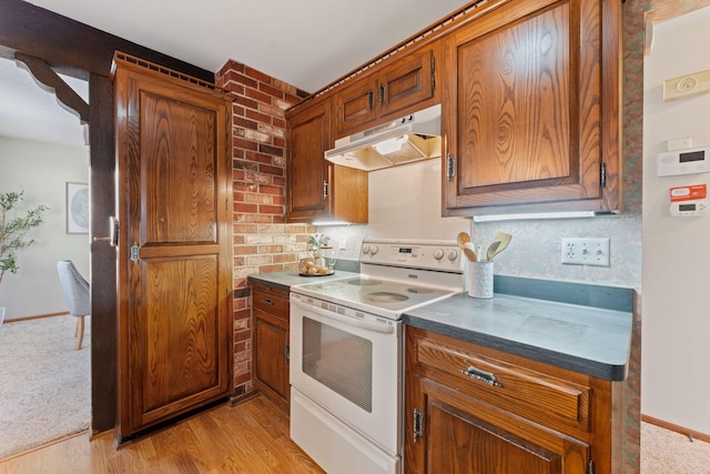 kitchen with light hardwood / wood-style flooring and white range with electric cooktop