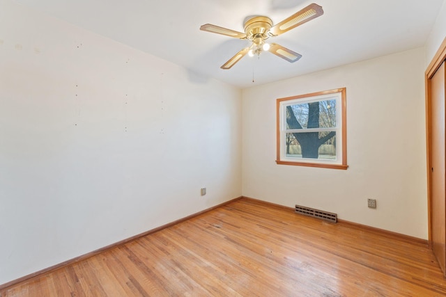 spare room with ceiling fan and light hardwood / wood-style flooring