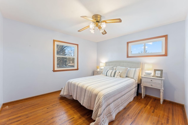 bedroom featuring wood-type flooring and ceiling fan