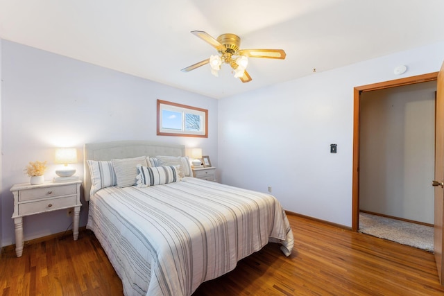 bedroom featuring hardwood / wood-style floors and ceiling fan