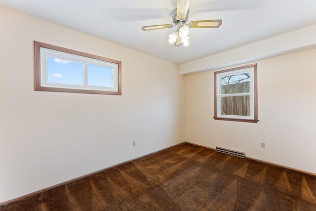 carpeted empty room featuring ceiling fan