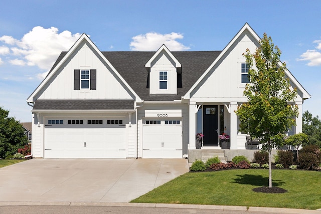 view of front of home featuring a garage and a front yard