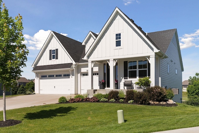 view of front facade with a porch, a garage, and a front yard