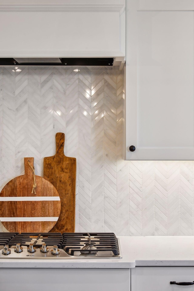 room details featuring white cabinetry and stainless steel gas cooktop