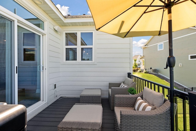 wooden deck featuring an outdoor hangout area