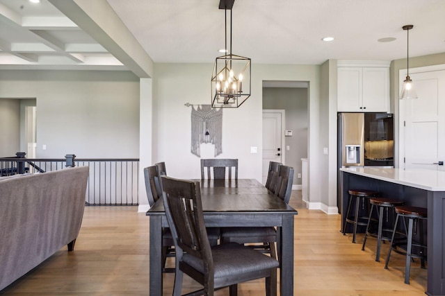 dining area with light wood-type flooring, coffered ceiling, and beamed ceiling