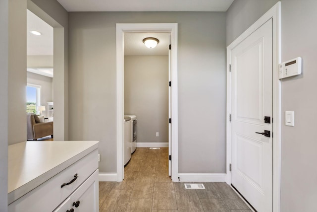 bathroom with washing machine and dryer