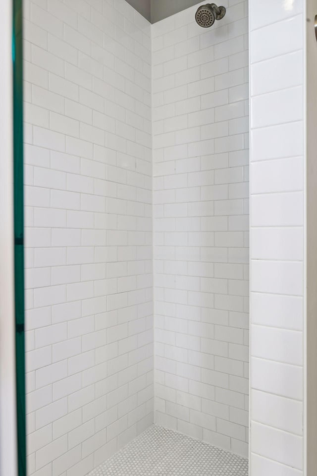 bathroom with tiled shower