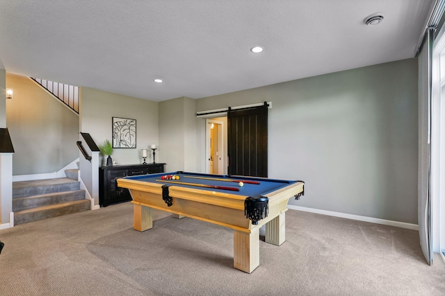 game room featuring carpet floors, pool table, and a barn door