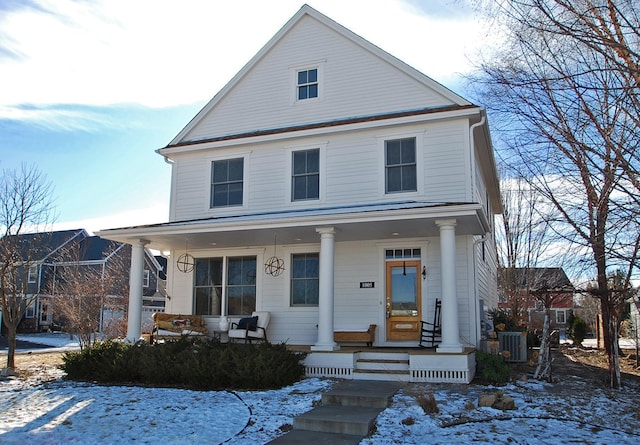 view of front facade featuring a porch and cooling unit