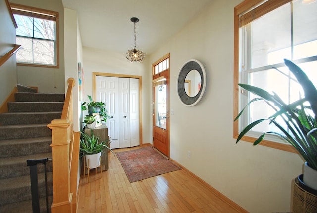 entryway with a healthy amount of sunlight and light hardwood / wood-style floors