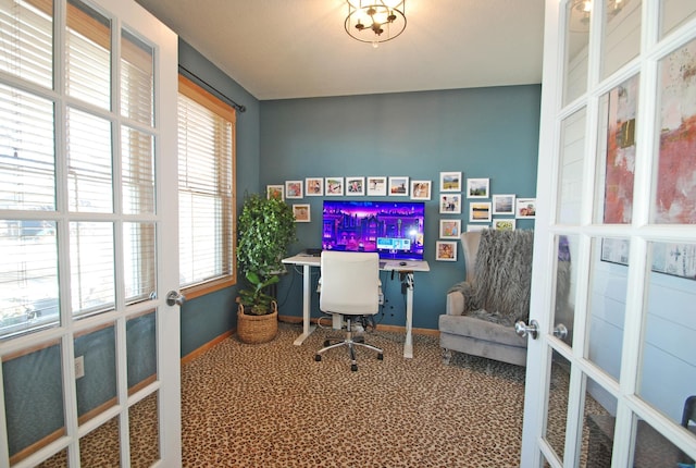 carpeted office featuring french doors