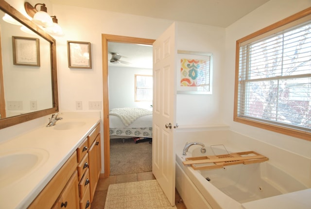 bathroom with vanity, tile patterned floors, and a bathing tub