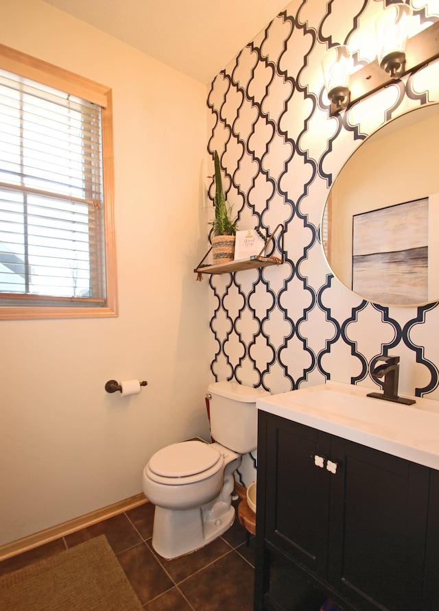 bathroom with vanity, tile patterned floors, and toilet