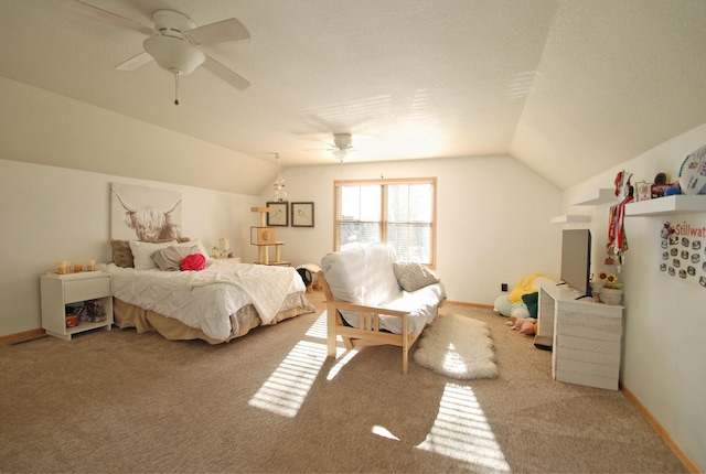 carpeted bedroom with vaulted ceiling and ceiling fan