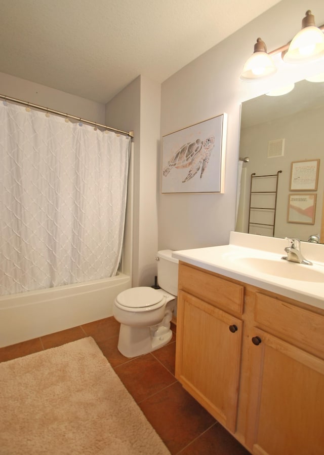 full bathroom with shower / bath combination with curtain, tile patterned flooring, vanity, toilet, and a textured ceiling