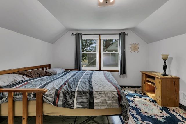 bedroom with lofted ceiling