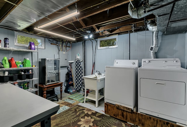 laundry room featuring separate washer and dryer and electric panel