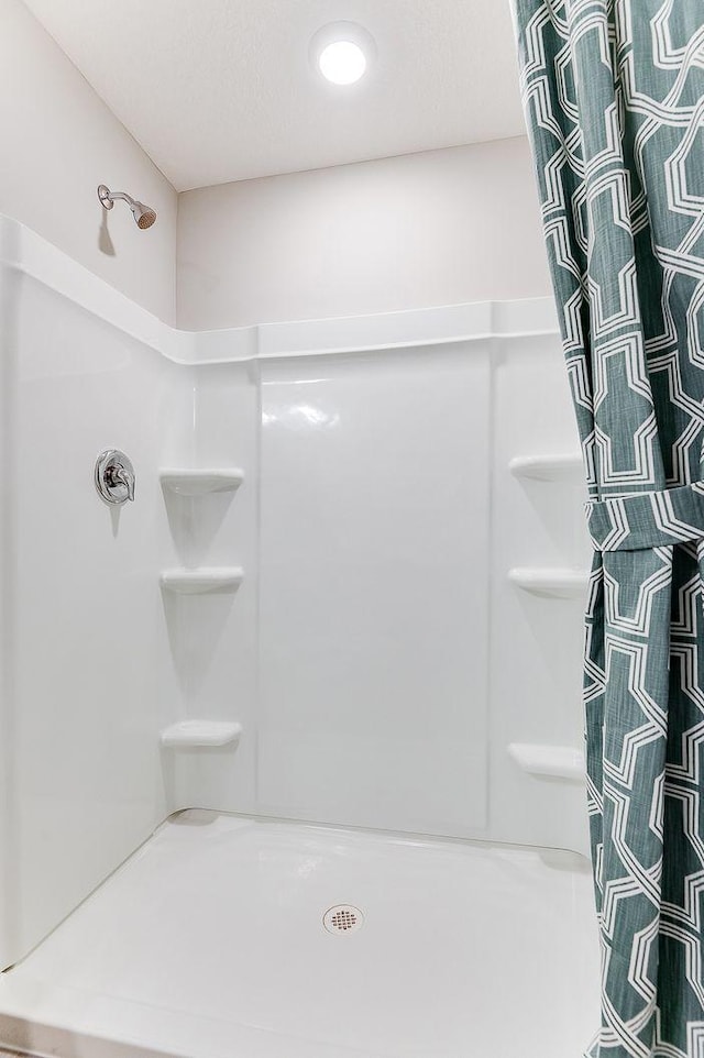 bathroom featuring walk in shower