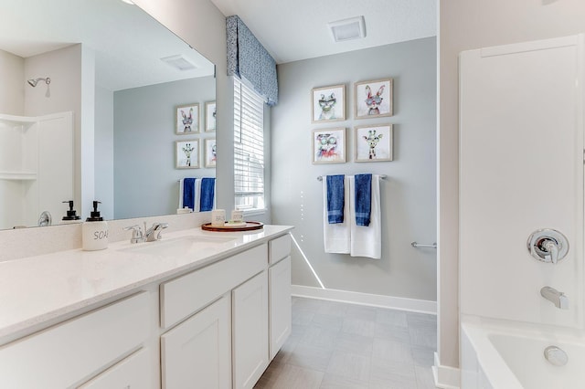 bathroom featuring vanity and shower / washtub combination