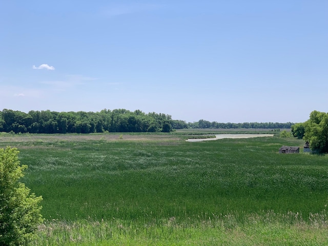 view of yard with a rural view