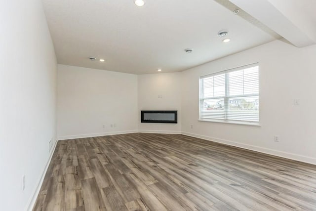 unfurnished living room with hardwood / wood-style floors