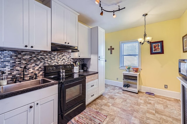 kitchen with sink, electric range, track lighting, decorative backsplash, and white cabinets