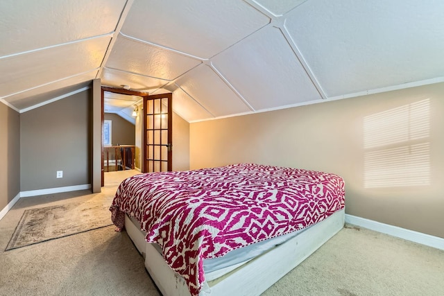 bedroom with lofted ceiling and carpet flooring