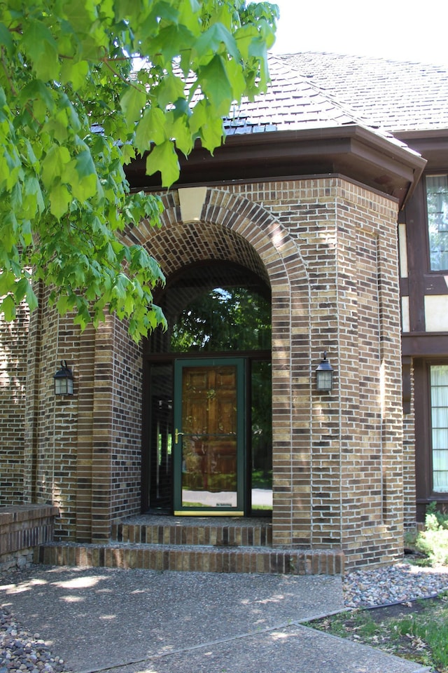 15802 Nursery Dr, Minnetonka, MN 55345 - property entrance featuring brick siding and a shingled roof