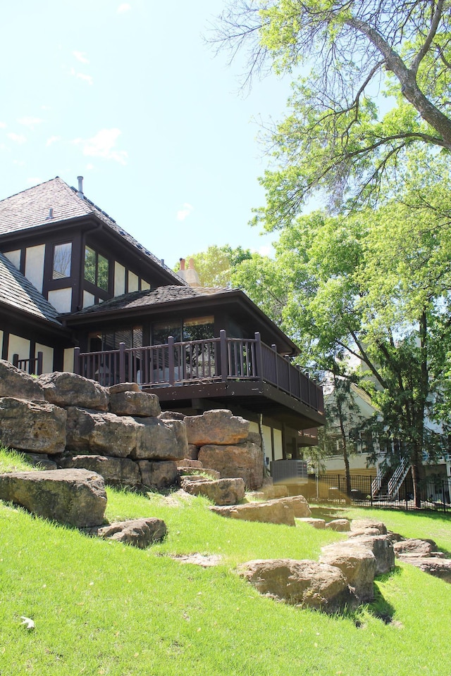 15802 Nursery Dr, Minnetonka, MN 55345 - back of property featuring a chimney, a lawn, and a wooden deck