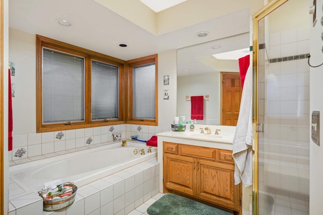 15802 Nursery Dr, Minnetonka, MN 55345 - bathroom with vanity, a bath, a stall shower, recessed lighting, and tile patterned floors