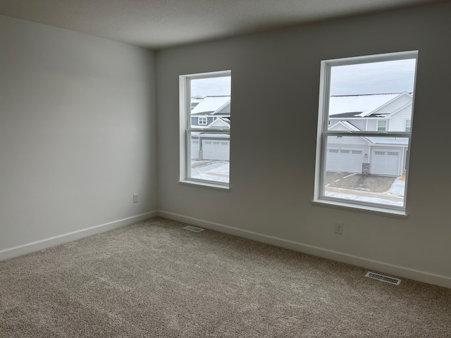 spare room with carpet flooring