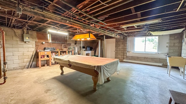 game room featuring concrete floors, a baseboard heating unit, pool table, and electric panel