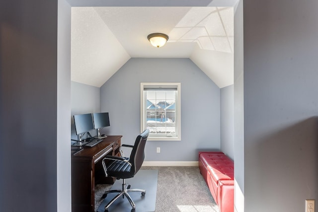 carpeted office with vaulted ceiling