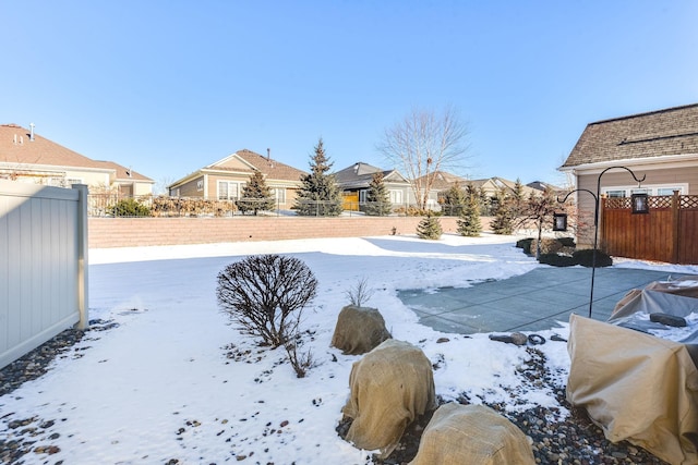 view of yard layered in snow