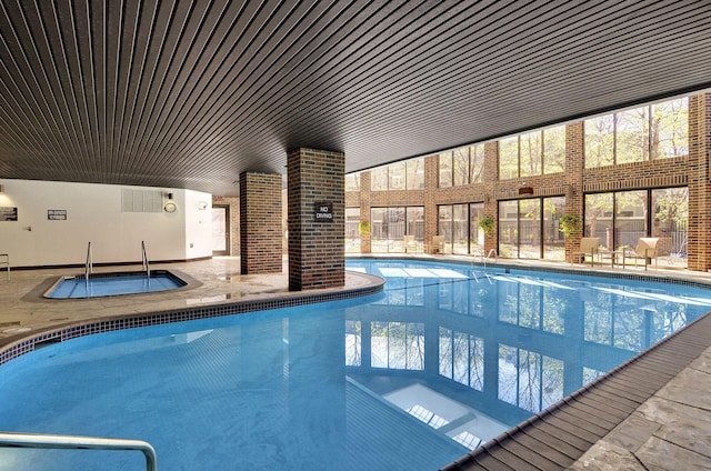 view of pool featuring an indoor hot tub