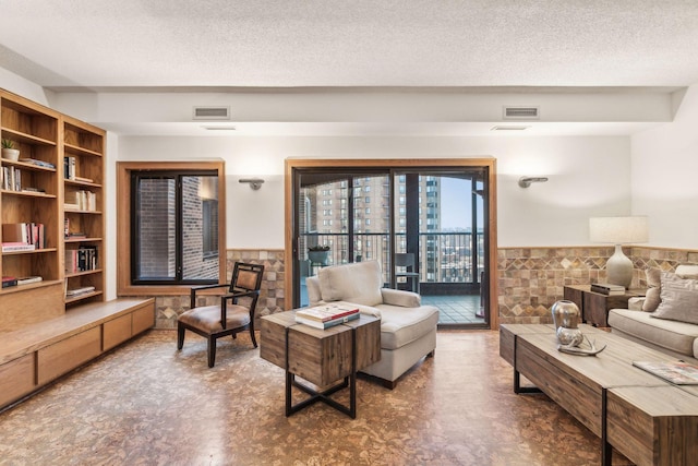 living room featuring a textured ceiling