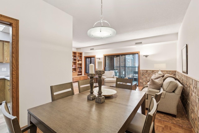 dining room with dark parquet floors