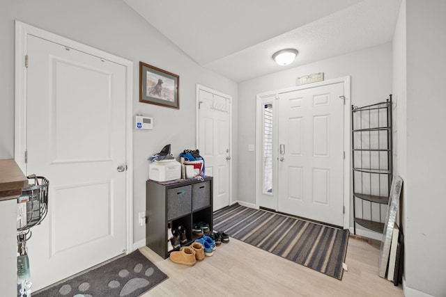 foyer entrance featuring light wood-type flooring