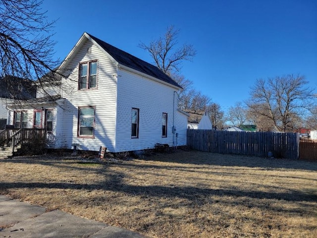 view of property exterior featuring a yard