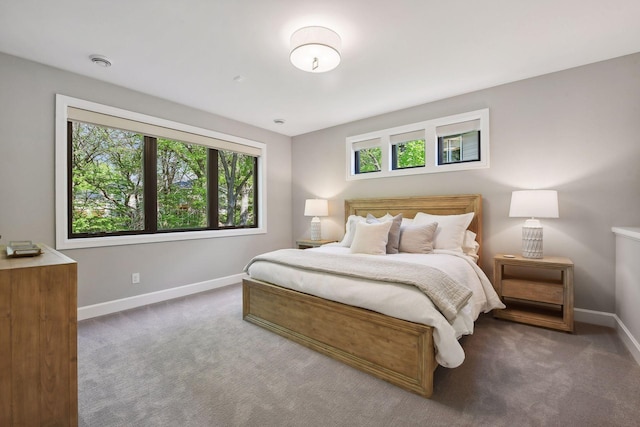 bedroom featuring dark carpet