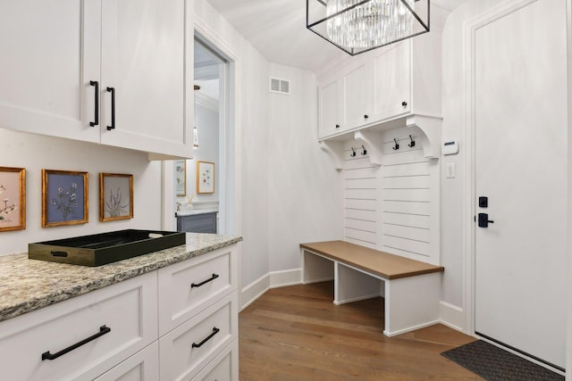 mudroom with wood-type flooring