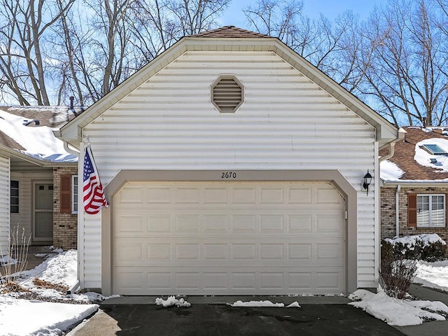 view of snow covered garage