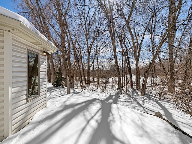 view of yard layered in snow