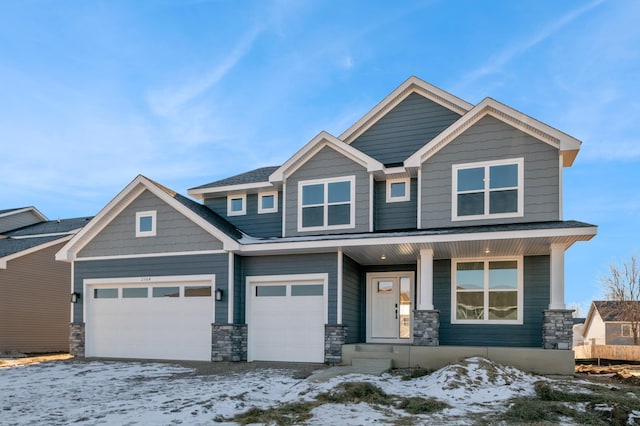 craftsman-style house featuring a garage and covered porch